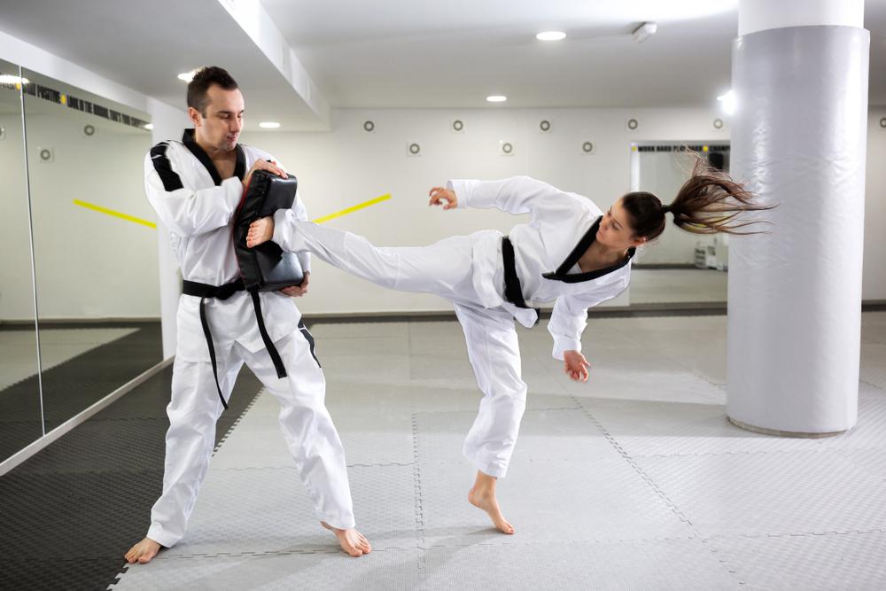 A man and a woman taekwondo athletes training