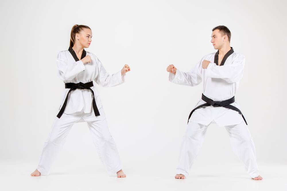 man and woman taekwondo players