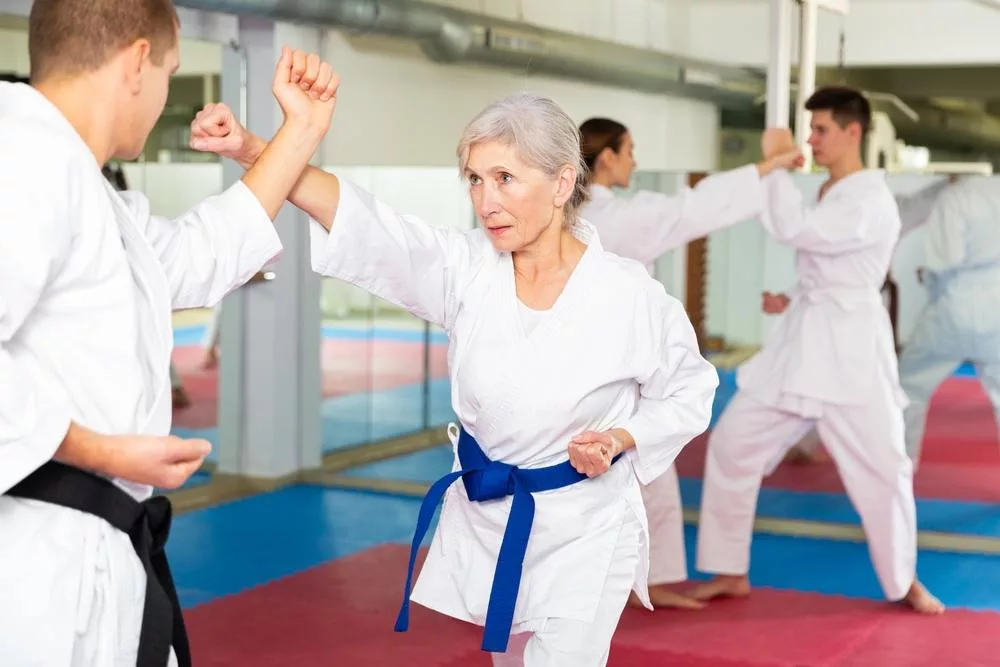 elderly karate woman training